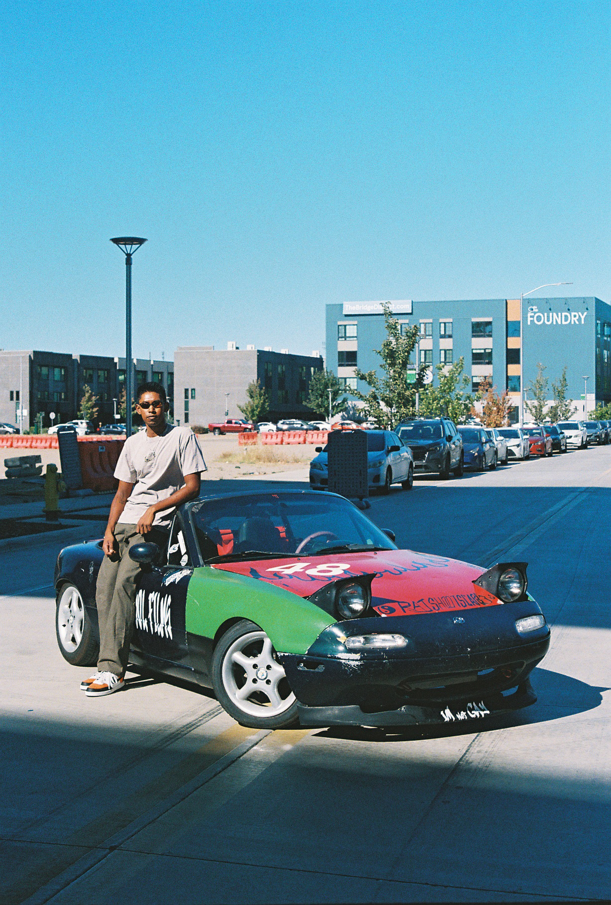 Noisyboy beside his colorful drift car